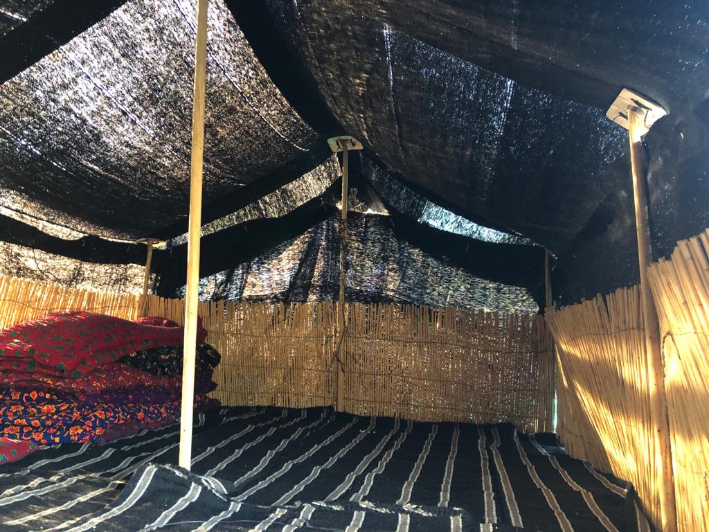 Anatolian Turkmen Black tent view from the inside with the reed screens placed on the edges